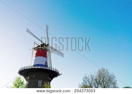 Windmill Of Leiden Wrapped In Netherlands Three Colored Flag, Holland Netherlands