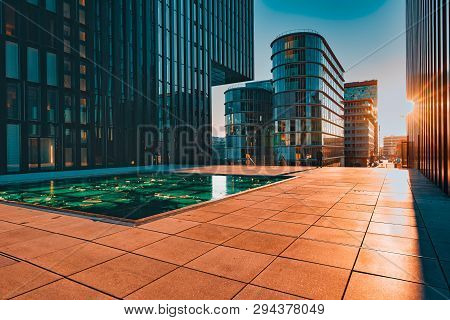 Duesseldorf, Germany - January 20, 2019: Modern Architecture Of New Harbour City Throws Long And Dra