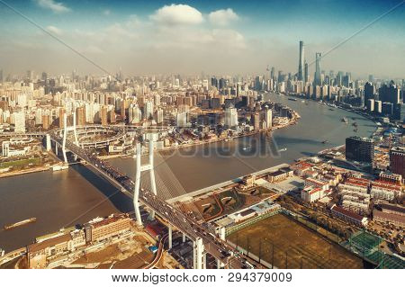 Shanghai Nanpu Bridge over Huangpu River with busy traffic in China.