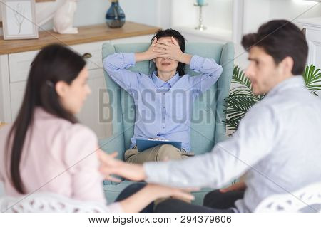 Impossible Reconciliation. Young Couple Arguing And Breaking Up In Marriage Counseling Session And Y