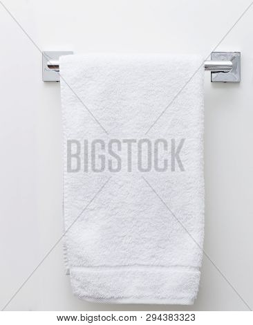 Modern Bathroom Towel Dryer On White Wall Background