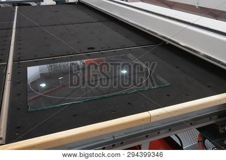Piece Of Transparent Glass Lays On Industrial Cnc Computer Remote Controlled Glass Cutter Water-jet 