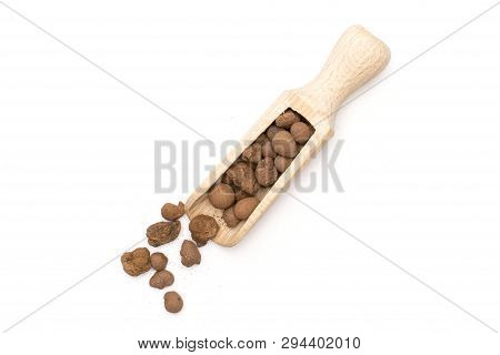 Lot Of Whole Brown Clay Pebbles (leca) With Wooden Scoop Flatlay Isolated On White Background