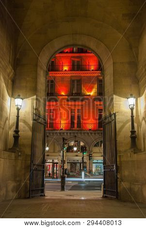 Paris, France - August 04, 2006: Arch entrance to the gallery of Vivien in the evening. An ancient historical passage and a tourist attraction in in France