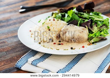 Veal Paupiette stewed with cream and rice