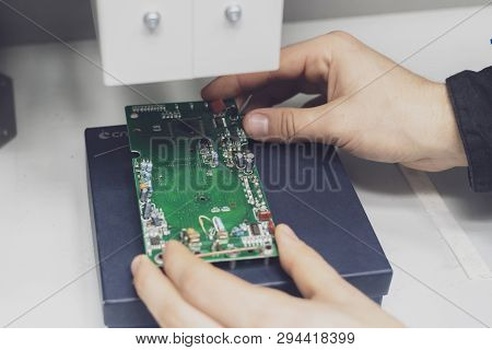 Scientist Wearing Blue Unifrom And Use X Ray Or Rontgen In Laboratory