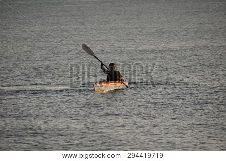 Captiva Island, Florida 08-05-2015 Young Woman Kayaks Off The Beach In Captiva Island In Partial Sil