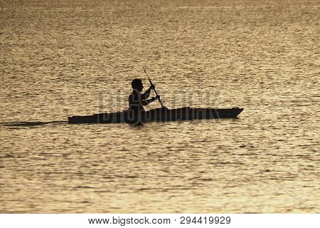 Captiva Island, Florida 08-05-2015 Young Man Kayaks Off The Beach In Captiva Island In Partial Silho