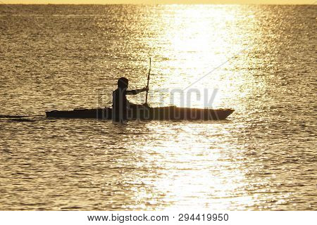 Captiva Island, Florida 08-05-2015 Young Man Kayaks Off The Beach In Captiva Island In Partial Silho