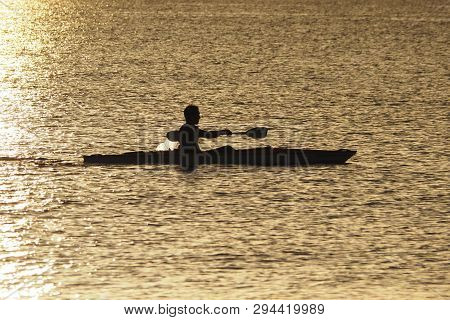 Captiva Island, Florida 08-05-2015 Young Man Kayaks Off The Beach In Captiva Island In Partial Silho