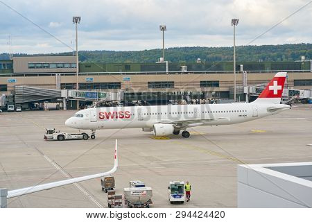 ZURICH, SWITZERLAND - CIRCA OCTOBER, 2018: an Swiss aircraft on pushback at Zurich International Airport.