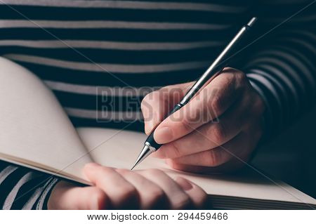Left-handed Woman Writing Diary, Close Up Of Hands With Pencil And Notebook