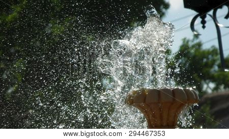 Summer, Fountain And Water Spray Formed By Strong Wind.