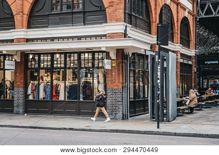 London, Uk - April 6, 2019: People Walking Past Spitalfields Market, One Of The Finest Surviving Vic
