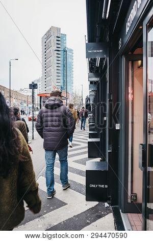 London, Uk - April 6, 2019: People Walking Past The Shops At Boxpark Shoreditch, London, Shipping Co