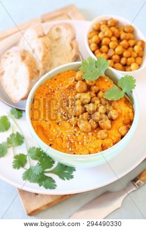Vegetarian Appetizer. Carrot And Hummus Dip And Bread, Sesame And Chick-pea Dressing On Light Backgr
