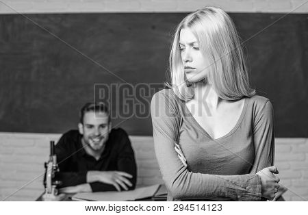 Taking An Exam. Female Student With Schoolmaster At Examination. Pretty Woman Standing Hands Crossed