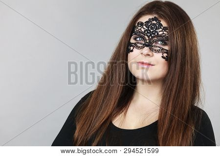 Pretty Mysterious Woman Wearing Black Eye Lace Mask Having Long Brown Hair.