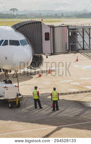 Jetway Connected To The Airplane For Boarding Passengers. Boarding Bridge.