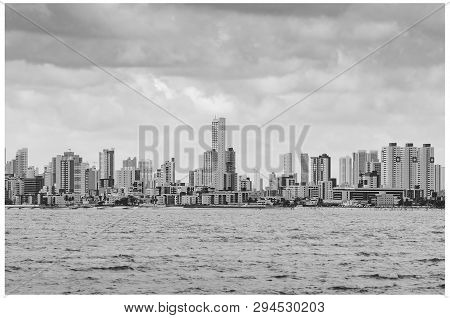 Bessa Beach Seen From The Middle Of The Sea. Buildings By The Sea At Praia Do Bessa And The City Of 