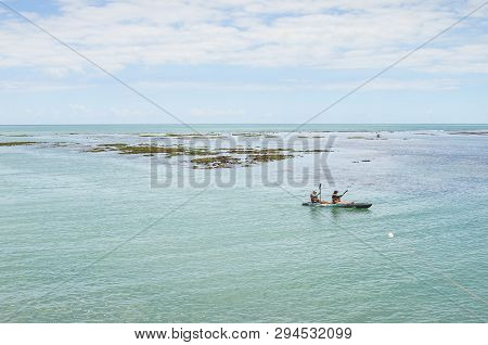 Joao Pessoa - Pb, Brazil - February 21, 2019: In The Middle Of Sea, Tourists Kayaking Between Banks 