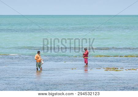 Joao Pessoa - Pb, Brazil - February 21, 2019: Local People Fishing In The Middle Of Sea, Near Corals