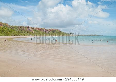 Conde - Pb, Brazil - February 22, 2019: Local People And Tourists At The Water Of Praia De Coqueirin