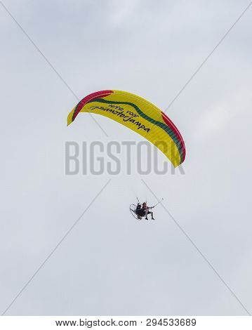 Joao Pessoa - Pb, Brazil - February 23, 2019: Flying On A Motor Paragliding. Tourist Being Guided On