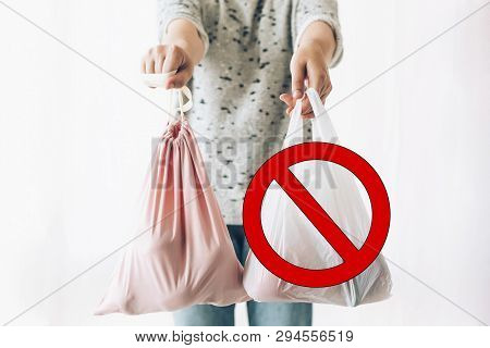 Ban Single Use Plastic, Stop Sign. Zero Waste Shopping Concept. Woman Holding In One Hand Groceries