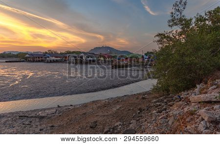 Stunning Sunset At Fishing Village In Phuket.during Low Tide Will Has A Small Canal Beside Fishing V