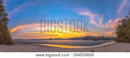 Stunning Sunset At Fishing Village In Phuket.during Low Tide Will Has A Small Canal Beside Fishing V