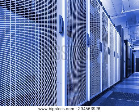Technical Wall Of Cellular Data Terminal. Row Of Telecom Backhaul Equipment In Modern Communication 