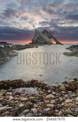 Bow-fidle Rock Sunrise Landscape On The Coast Of Scotland On A Cloudy Morning