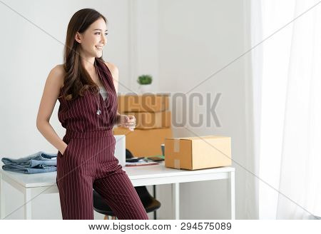 Young Asian Casual Woman Working Small Business Owner Standing Looking In Distance Thinking Of Futur