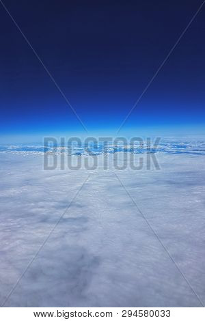 Low Earth Orbit - View Of White Clouds And Mountains During The Flight To The Low Orbit Of The Earth