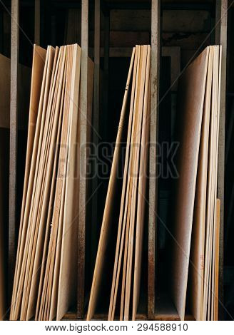 Large Rectanguler Wood Panels Stacked Up Together In Display