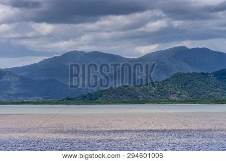 Cairns, Australia - February 17, 2019: Coral Sea Water In Front Of The Town, White Of Buildings. Hor