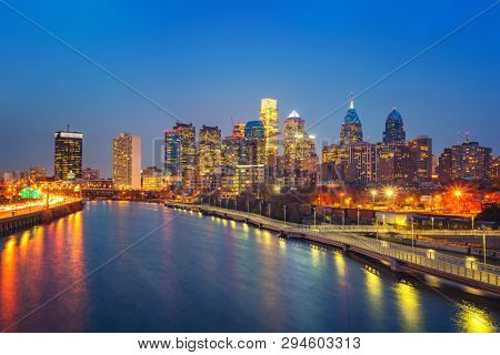 Panoramic picture of Philadelphia skyline and Schuylkill river at night, PA, USA.