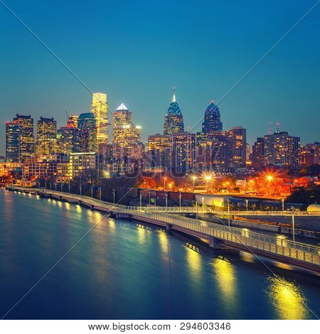 Panoramic picture of Philadelphia skyline and Schuylkill river at night, PA, USA.