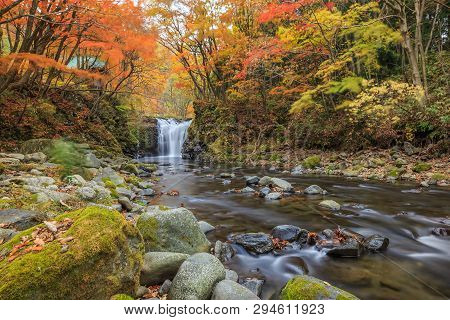 Waterfall With Vibrant Trees In Autumn, Tometaki Waterfall - Kazuno, Akita, Japan