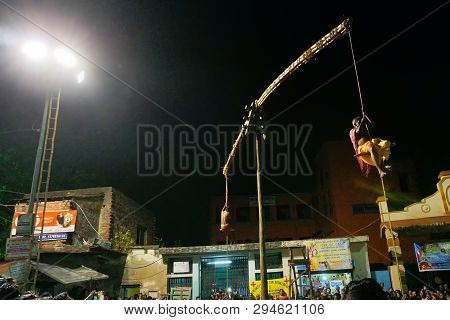 Kolkata, West Bengal, India - 15 April 2018: Two Hindu Devotees Are Hanging From Pole In Air, At Nig
