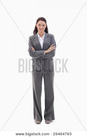 Businesswoman crossing her arms against white background