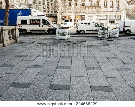 Paris, France - Mar 19, 2019: Debris Bags After Protest By Yellow Vests And White Orange Telecom Van