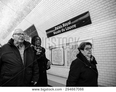 Paris, France - Mar 19, 2019: Group Of Commuters People Walking Inside Paris Metro At The Palais Roy