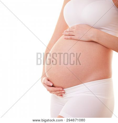 Image of pregnant woman touching her big belly. Close up. Motherhood, pregnancy, people and expectation concept. Pregnant woman expecting baby