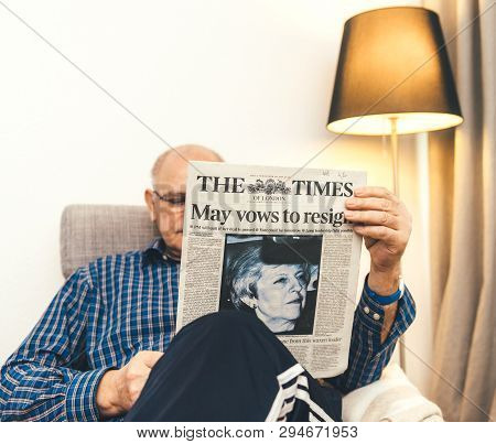 Paris, France - 29 Mar 2019: Relaxed Man Reading In Lving Room Latest British The Times Of London Ne