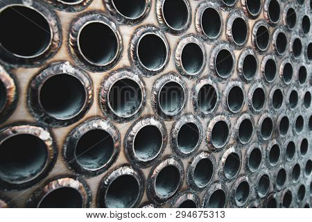 Tube Sheet Of The Heat Exchanger For Maintenance, The Water Heater In The Boiler As Background