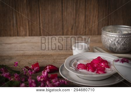 Thapthim Krop, Mock Pomegranate Seeds In Coconut And Syrup In The White Bowl On The Wood Table There