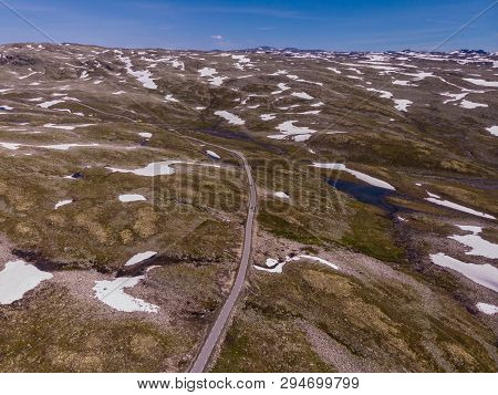 Mountain Region Between Aurland And Laerdal In Norway. Rocky Landscape With Road. National Tourist S
