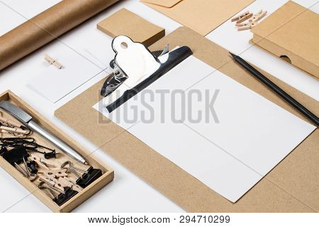 Folder, Boxes, Envelope And Other Office Suplies On A White Desk